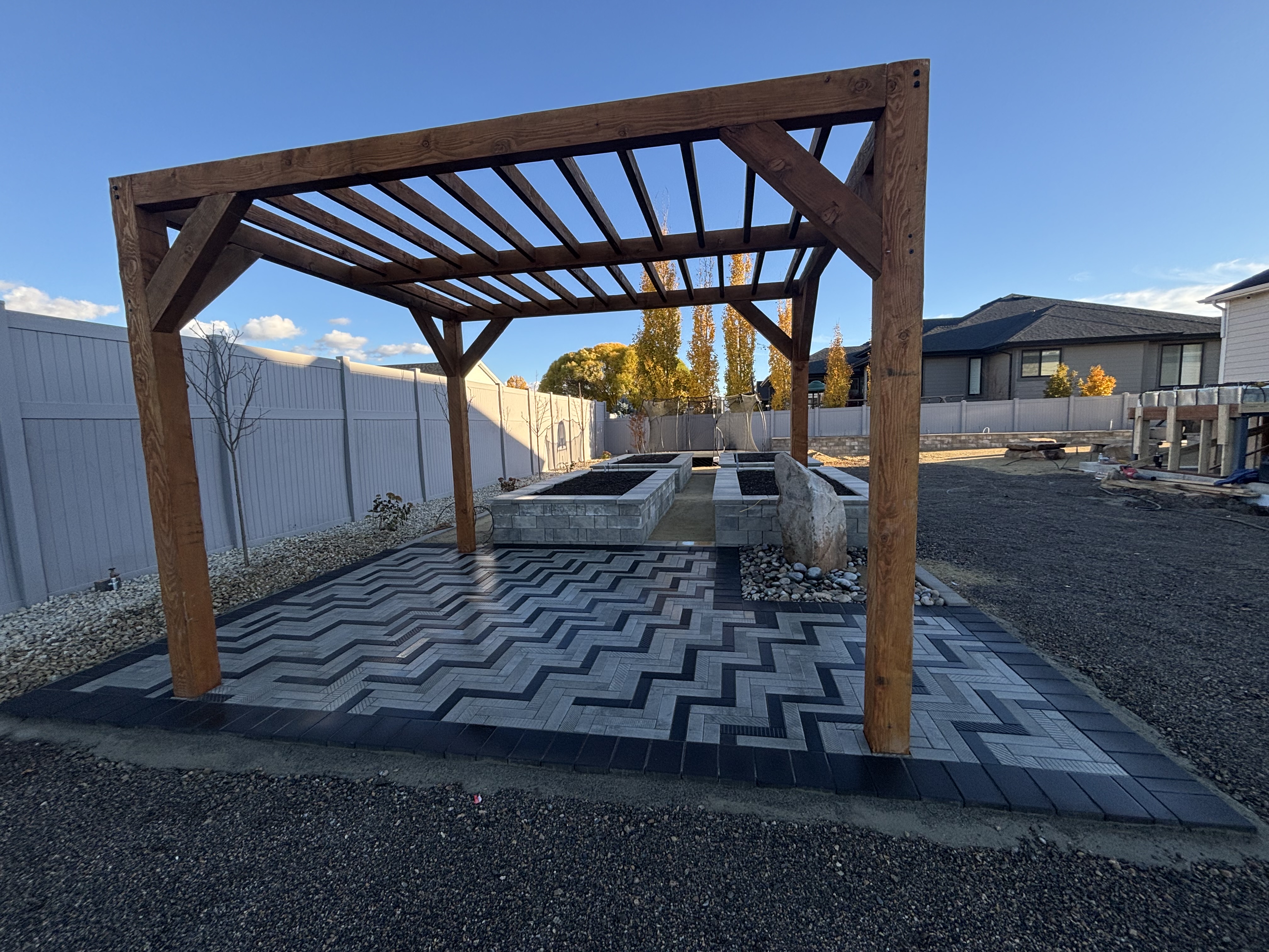 Chevron paver patio with pergola