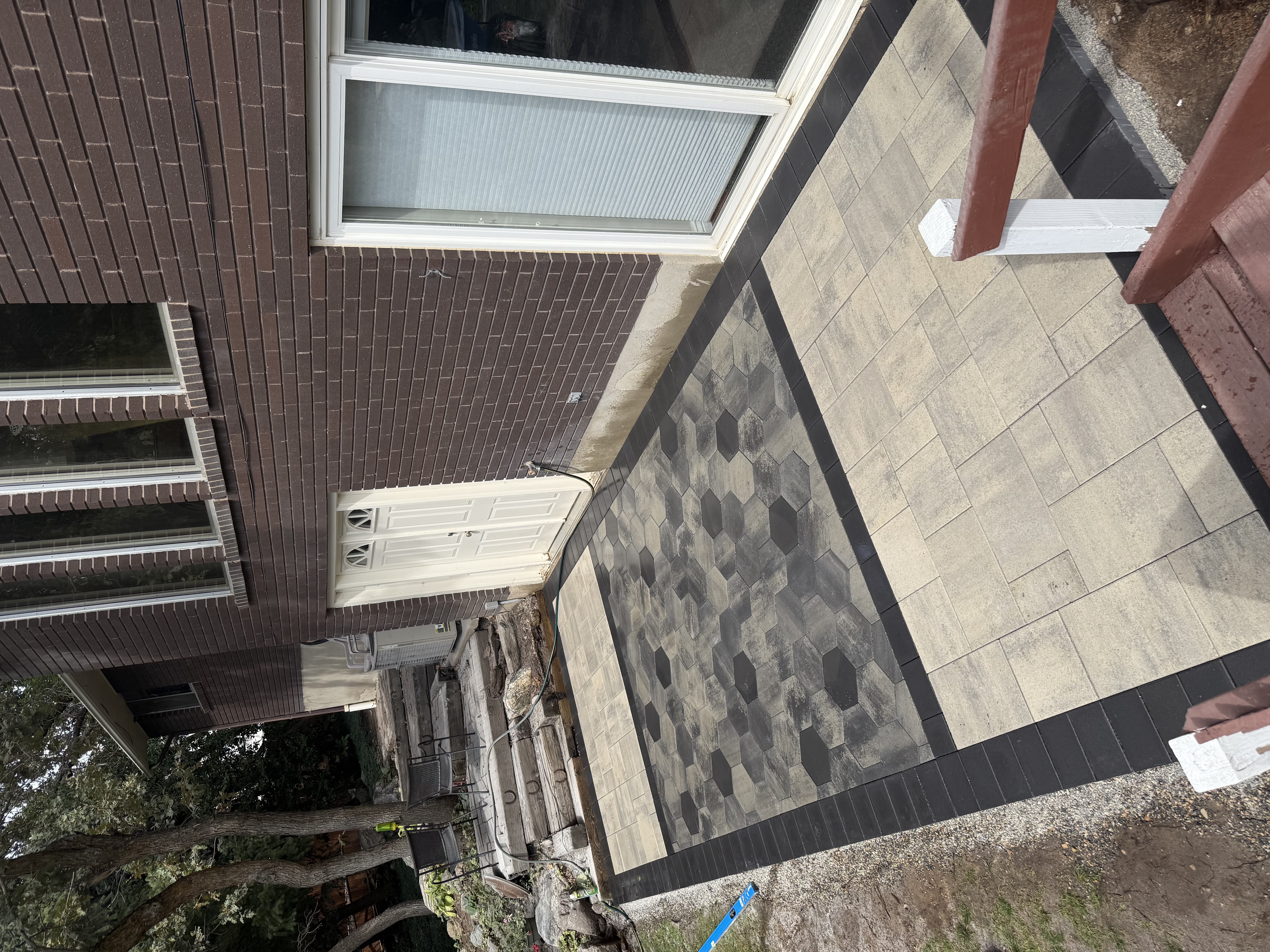 Custom paver patio with decorative inlay
