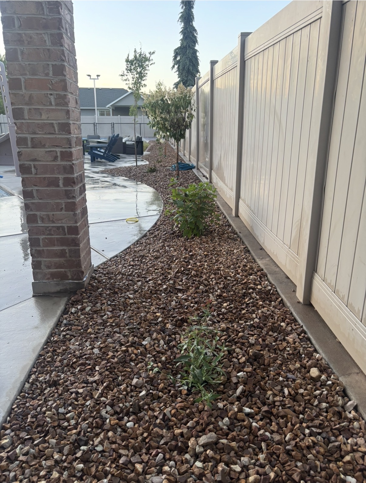 Side yard with rock mulch and accent planting