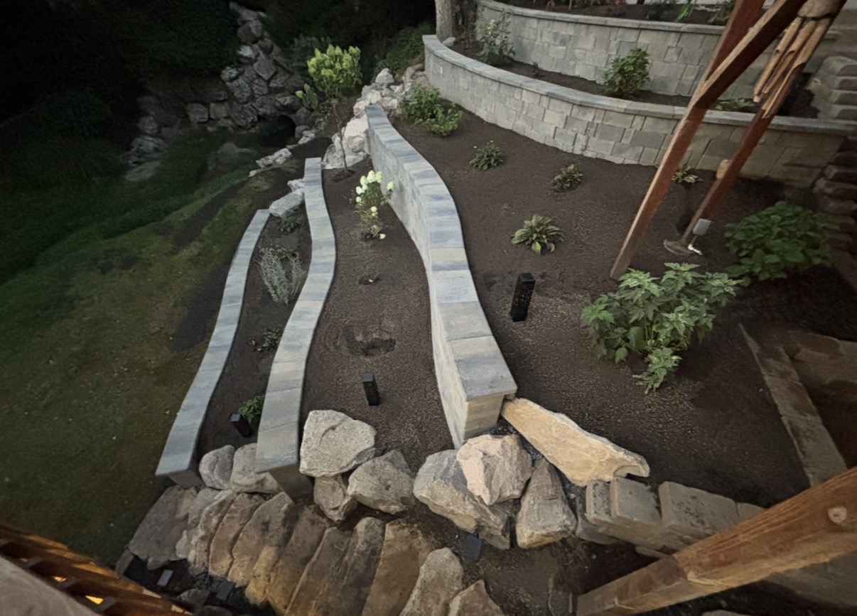 Custom curved seat walls with boulder feature