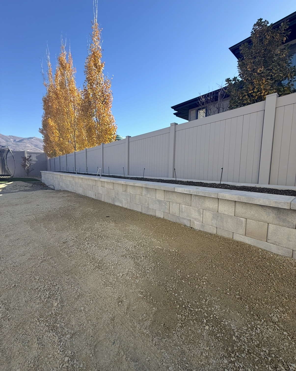 Long block retaining wall along property line